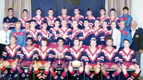 The Warwick Cowboys premiership winning under-18 side in 1990: (Front, from left) Richard Osborne, Richard Roberts, Peter Bland, James Jerome, captain Tony McGahan, Heath Hill, Alfie Boney, Dan O’Grady, (middle) patron Tony Maroon, co manager Paul Doyle, president Peter Small, Justin Anderson, Tony Roche, Todd Jefferies, Peter McMahon, Scott Mullaly, vice captain Craig Scanlan, Brett Blewitt, Tony Murphy, sponsor Mark Leith, co manager Peter Roser, secretary Kev Collins, (third row), coach David Abood, Kerry Scanlan, Phil Watts, Basil Nolan, Brad Watson, Paul Hilton, Mick Mundey, Brad Eyre, Nicholas Mapes, strapper Noel Loudon. The Warwick Cowboys premiership winning under-18 side in 1990: (Front, from left) Richard Osborne, Richard Roberts, Peter Bland, James Jerome, captain Tony McGahan, Heath Hill, Alfie Boney, Dan O’Grady, (middle) patron Tony Maroon, co manager Paul Doyle, president Peter Small, Justin Anderson, Tony Roche, Todd Jefferies, Peter McMahon, Scott Mullaly, vice captain Craig Scanlan, Brett Blewitt, Tony Murphy, sponsor Mark Leith, co manager Peter Roser, secretary Kev Collins, (third row), coach David Abood, Kerry Scanlan, Phil Watts, Basil Nolan, Brad Watson, Paul Hilton, Mick Mundey, Brad Eyre, Nicholas Mapes, strapper Noel Loudon.
